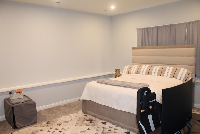 bedroom with recessed lighting, light colored carpet, and baseboards