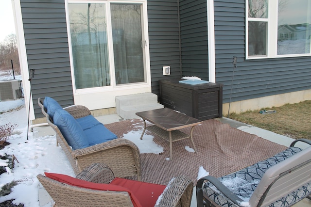 snow covered patio featuring entry steps