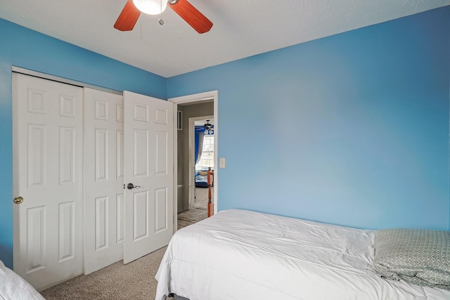 bedroom featuring ceiling fan, carpet floors, and a closet