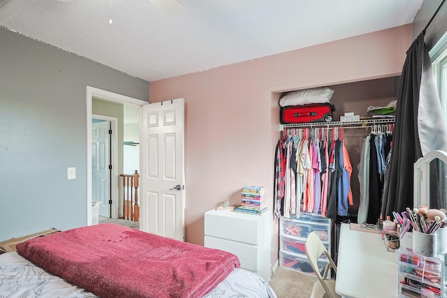 carpeted bedroom with a closet