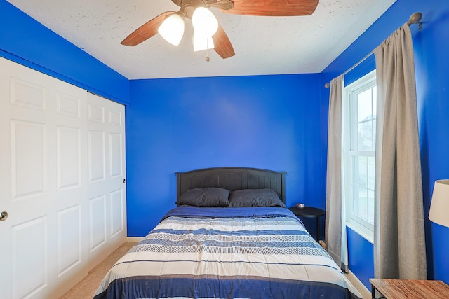 bedroom featuring a ceiling fan and carpet floors