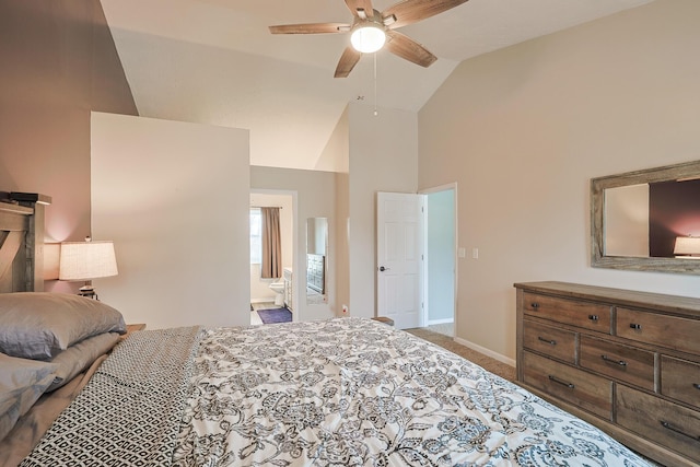 carpeted bedroom with high vaulted ceiling, ensuite bath, baseboards, and a ceiling fan