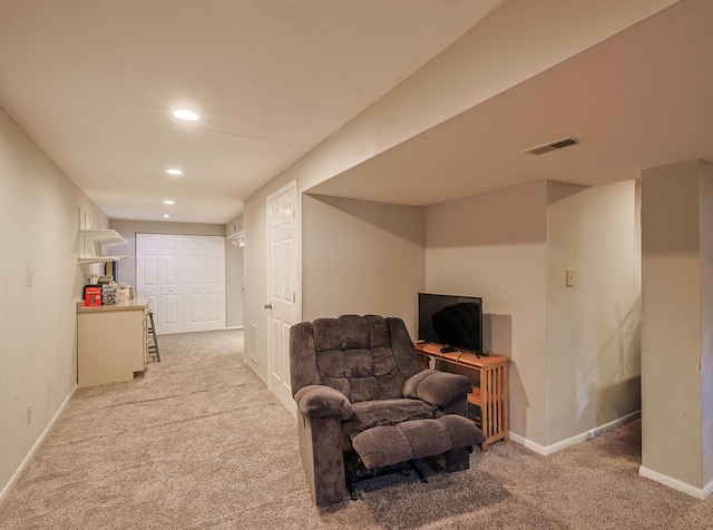 sitting room with baseboards, recessed lighting, visible vents, and light colored carpet