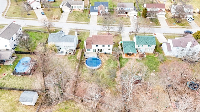 birds eye view of property with a residential view