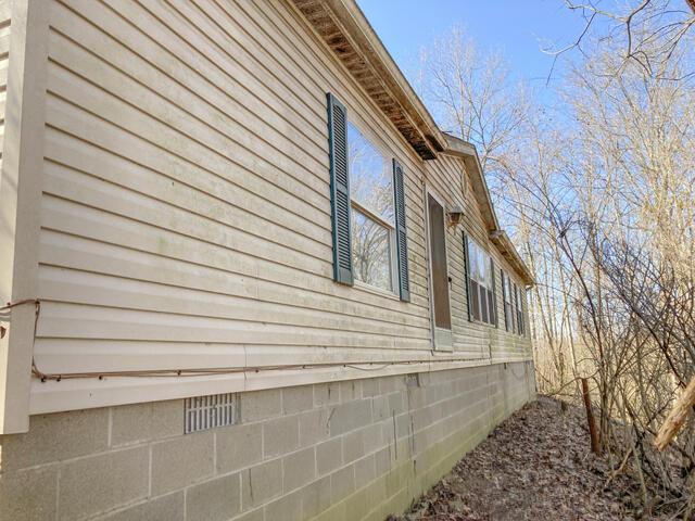 view of home's exterior featuring crawl space