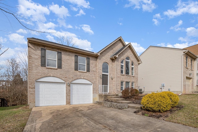 view of front of house with brick siding, driveway, and an attached garage