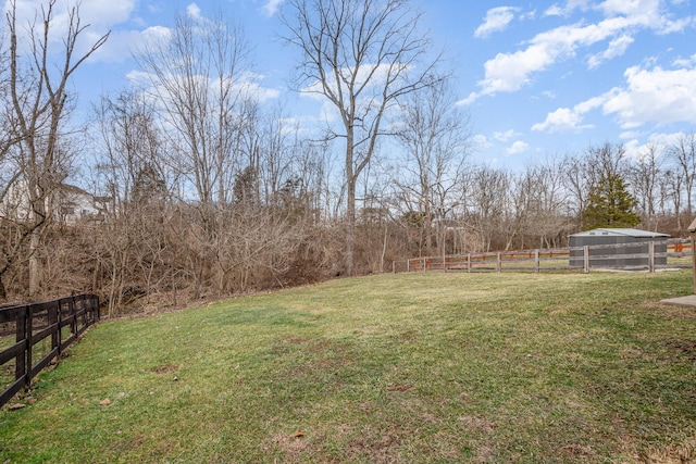 view of yard featuring a rural view and fence