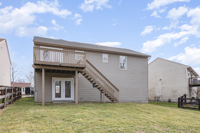 rear view of property with stairs, a yard, french doors, and a wooden deck