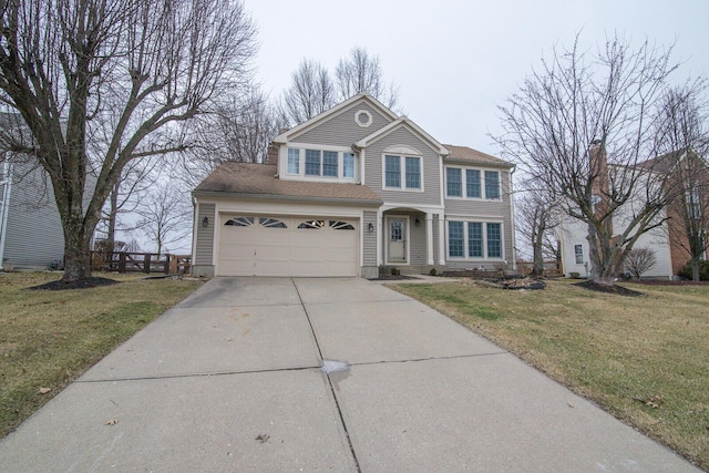 traditional home featuring a garage, driveway, and a front yard