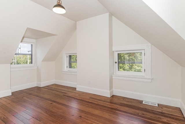 bonus room featuring hardwood / wood-style flooring, plenty of natural light, and visible vents