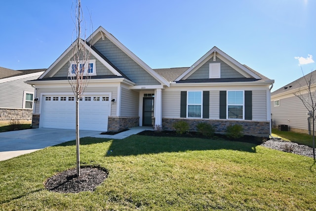 craftsman inspired home featuring a garage, a front yard, stone siding, and concrete driveway