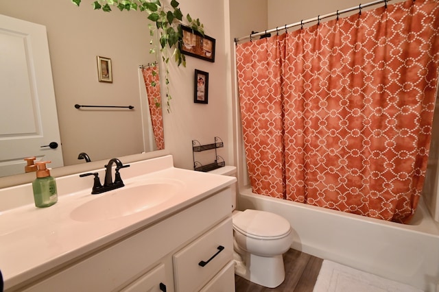 full bath featuring toilet, shower / tub combo with curtain, wood finished floors, and vanity