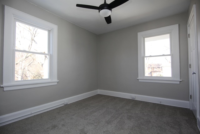 spare room with ceiling fan, baseboards, and carpet flooring