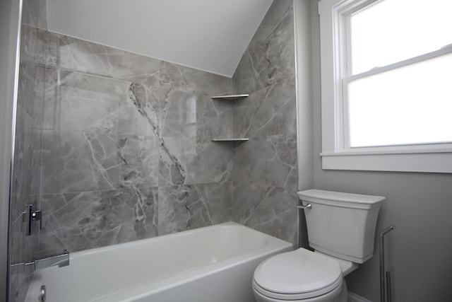 bathroom featuring toilet, shower / bath combination, plenty of natural light, and lofted ceiling