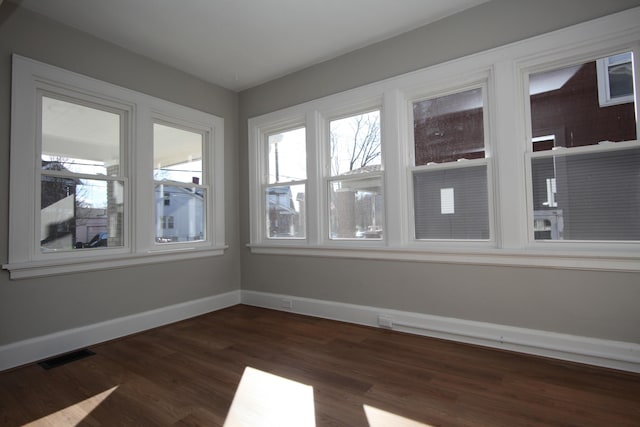 unfurnished sunroom with visible vents