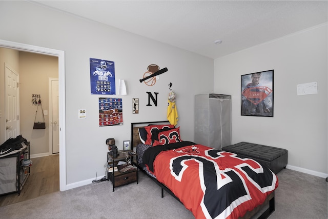 bedroom featuring carpet flooring and baseboards