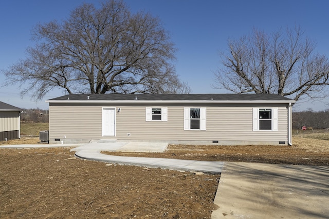 rear view of house featuring cooling unit and crawl space