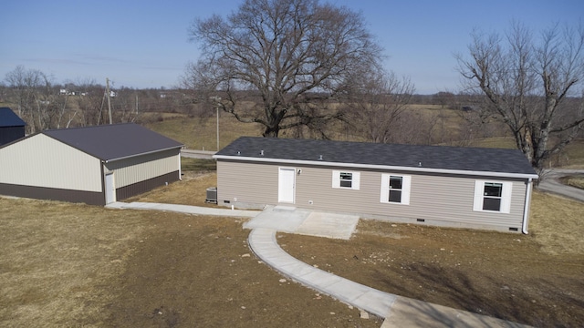 view of front facade with central AC and crawl space