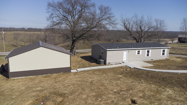 exterior space featuring cooling unit, crawl space, and a lawn