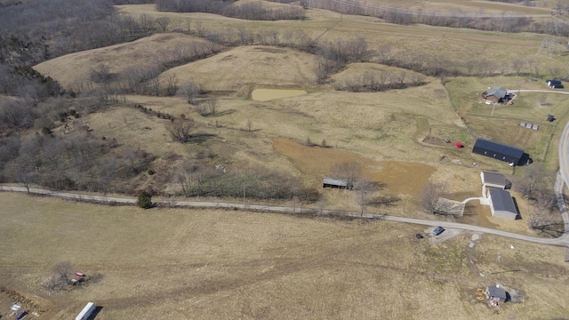 birds eye view of property with a rural view