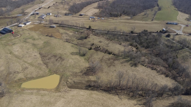 birds eye view of property with a rural view