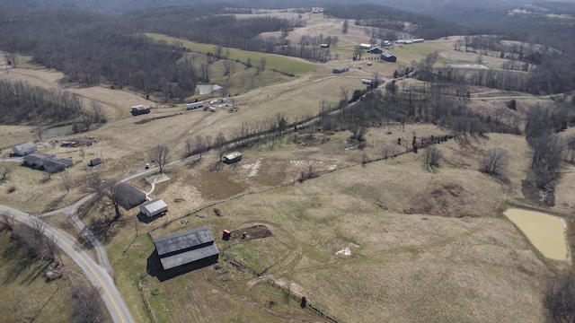 birds eye view of property with a rural view