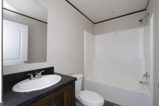 full bathroom featuring toilet, ornamental molding, tub / shower combination, and vanity