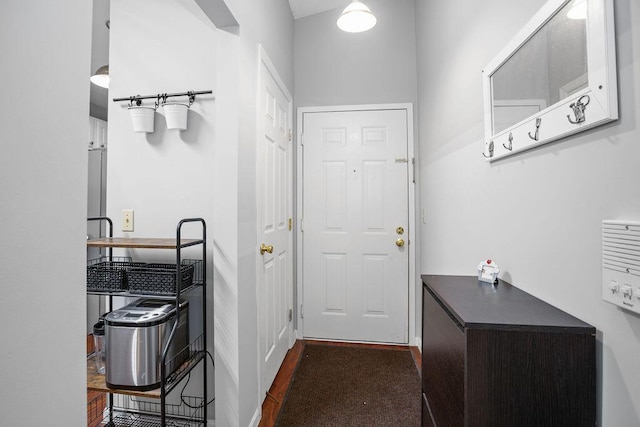 doorway to outside featuring dark wood-style floors