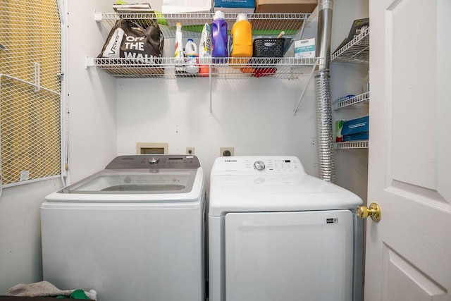 laundry area with laundry area and separate washer and dryer