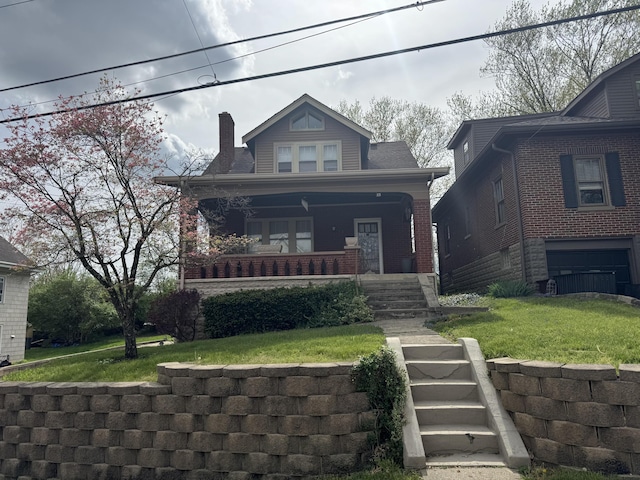 53 Brentwood Pl, Fort Thomas, KY 41075 - bungalow with brick siding, a porch, a front yard, and a chimney