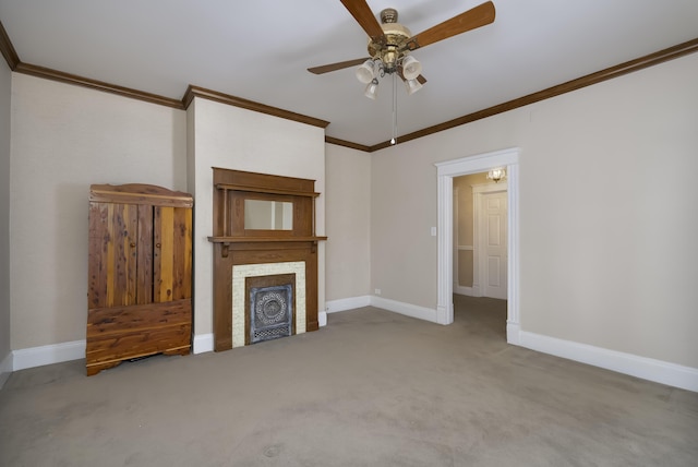 unfurnished living room featuring light carpet, baseboards, ceiling fan, crown molding, and a fireplace