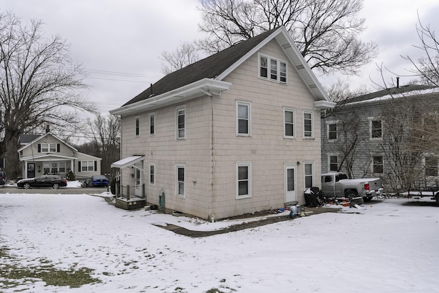 view of snow covered house