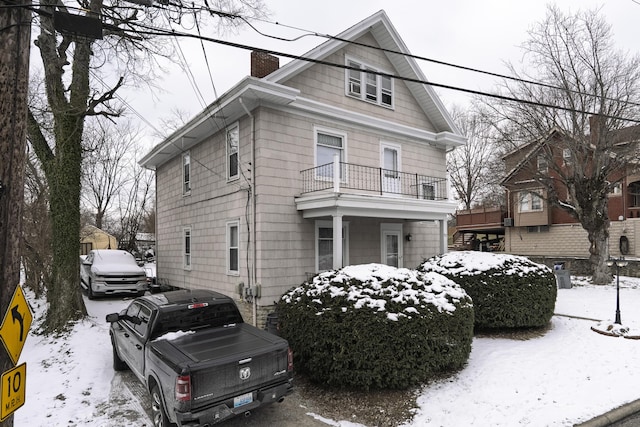 view of front of home with a chimney