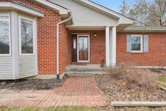 entrance to property with brick siding