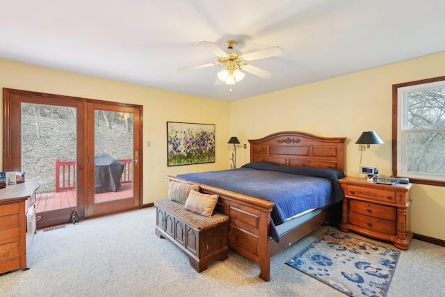 bedroom with baseboards, access to outside, a ceiling fan, and light colored carpet