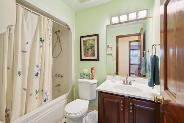 bathroom with visible vents, shower / tub combo, vanity, and toilet