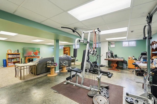 workout area featuring a paneled ceiling