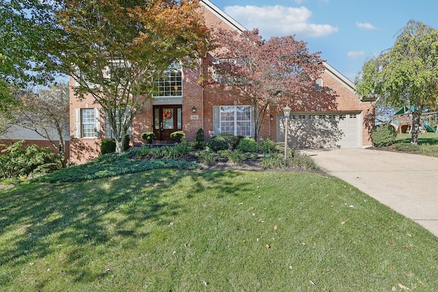 view of front of property with brick siding, a garage, a front lawn, and driveway