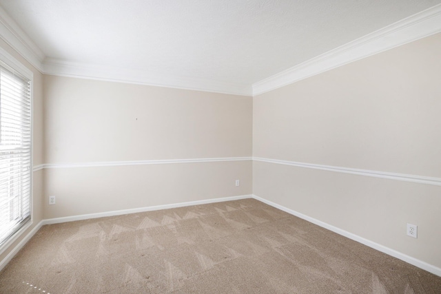 carpeted empty room with baseboards and ornamental molding