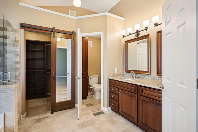 bathroom featuring visible vents, toilet, vaulted ceiling, a stall shower, and vanity