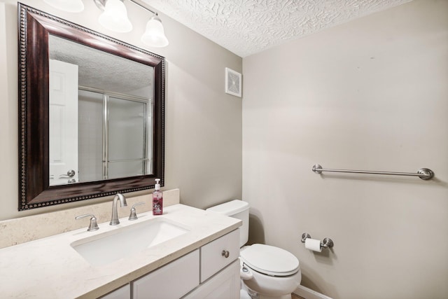 bathroom featuring a shower with door, visible vents, a textured ceiling, and toilet