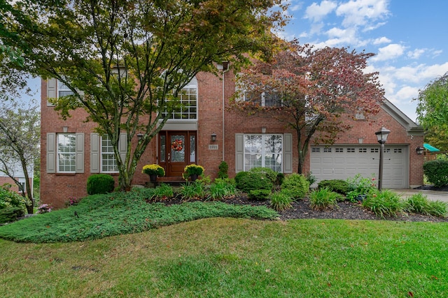 view of front of property featuring brick siding, a garage, concrete driveway, and a front lawn