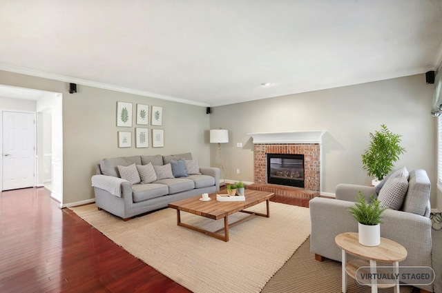 living room featuring crown molding, wood finished floors, and baseboards