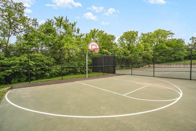 view of sport court featuring community basketball court and fence