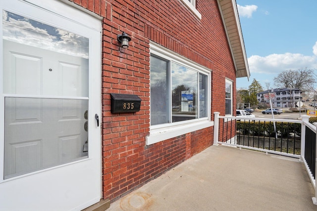 property entrance with brick siding