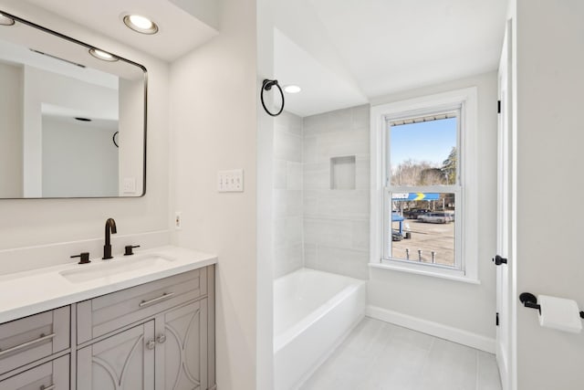 full bath with shower / bathtub combination, tile patterned flooring, recessed lighting, vanity, and baseboards