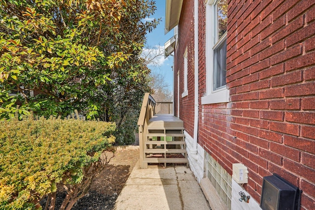 view of property exterior featuring brick siding