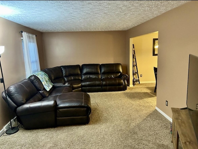 living room with carpet flooring, a textured ceiling, and baseboards