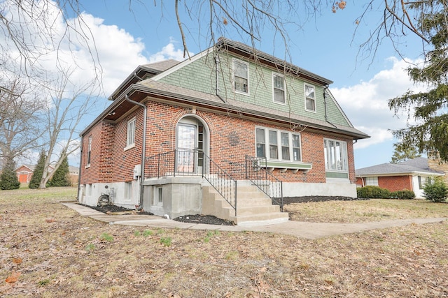 view of front facade featuring brick siding