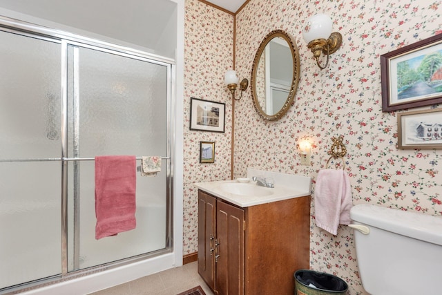 full bathroom with a shower stall, vanity, and wallpapered walls